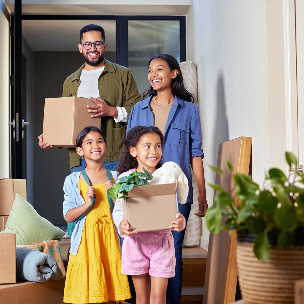 family holding boxes